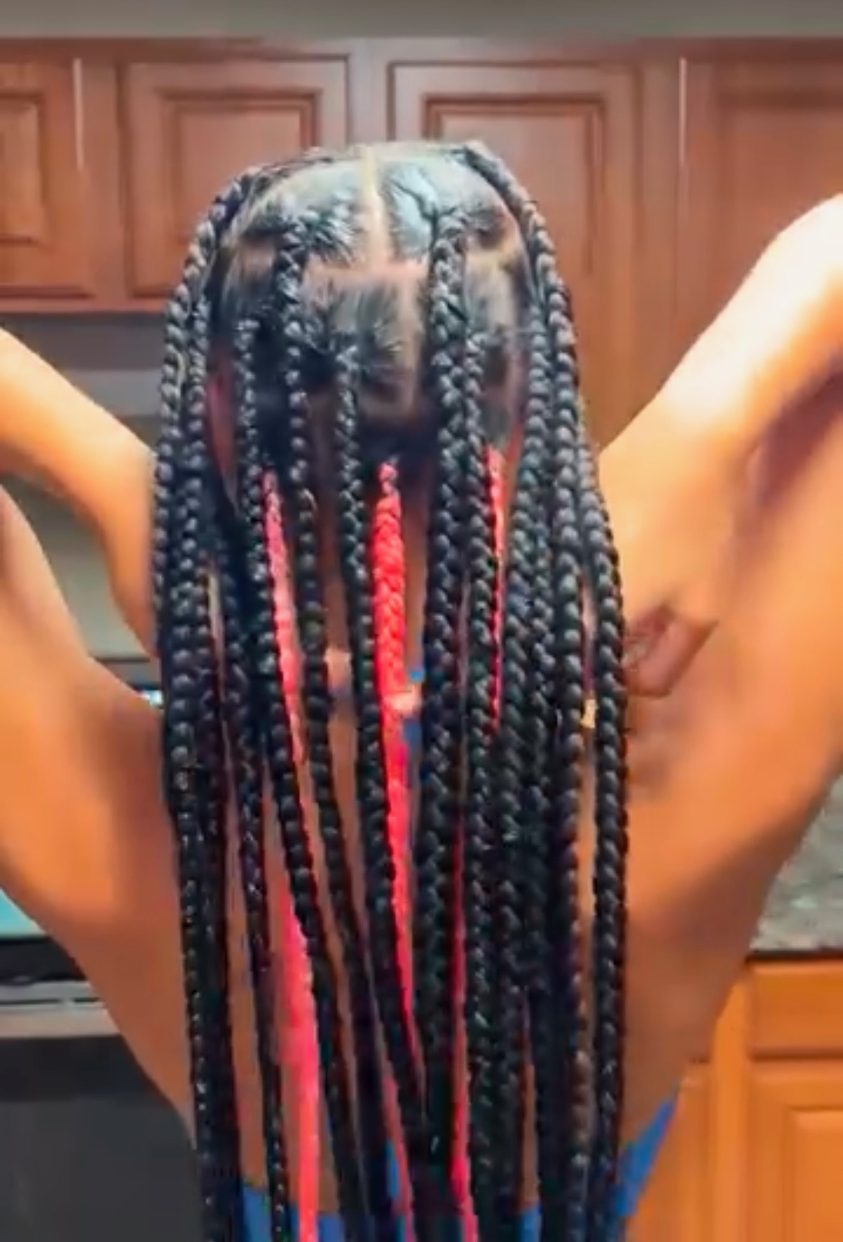 Long small knotless braids with pink peekaboo strands